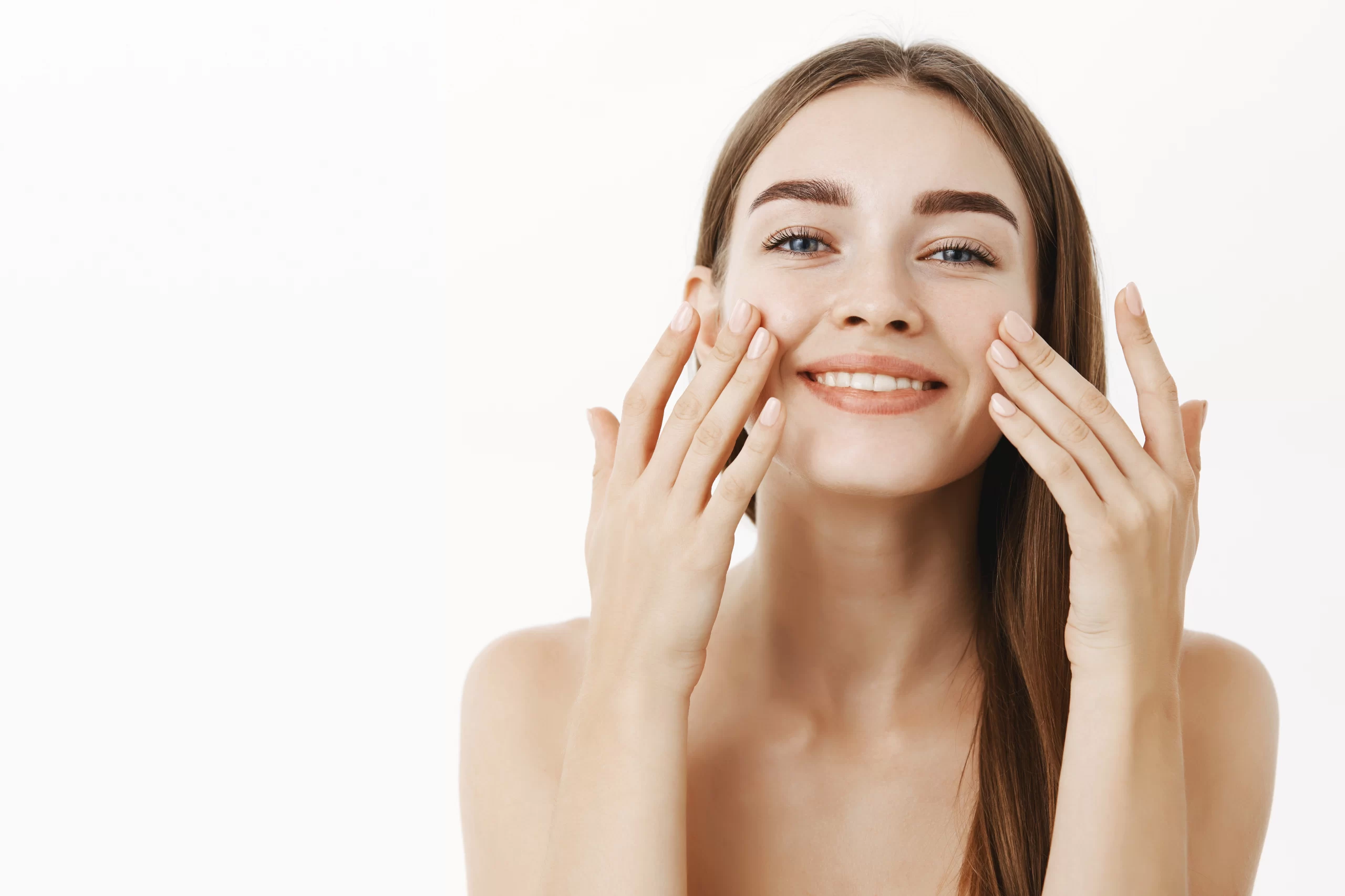 charming relaxed gentle young woman making cosmetological procedure applying facial cream face with scaled 1